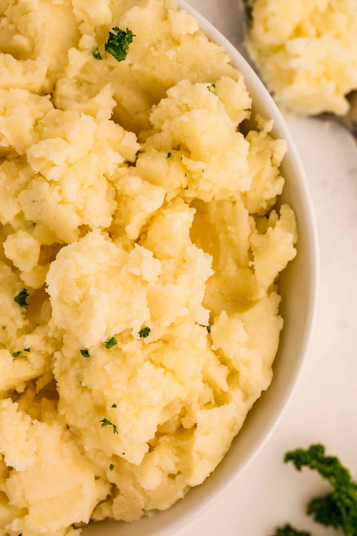 overhead close up view of mashed potatoes in bowl
