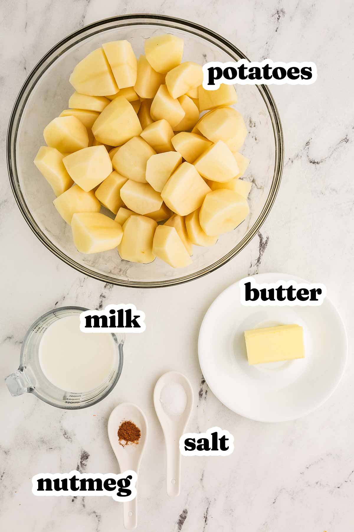 overhead view of ingredients to make mashed potatoes with text labels