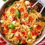 overhead view of skillet filled with tomato basil pasta
