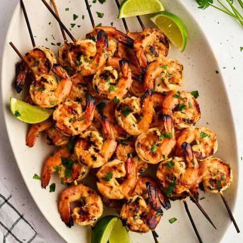grilled shrimp skewers on platter